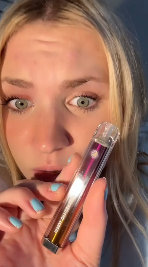 Person holding herbal diffuser.